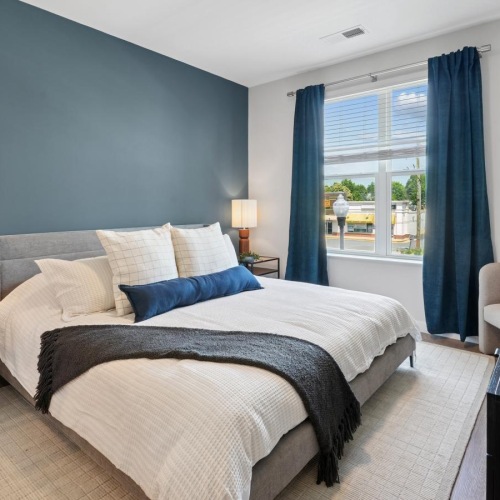 Bedroom with natural lighting and high ceilings
