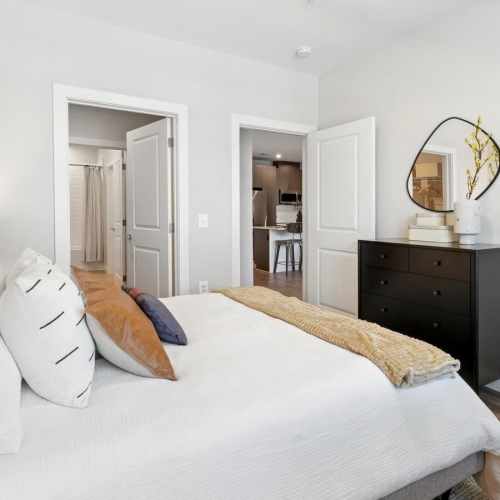 Bedroom with ample lighting and high ceilings