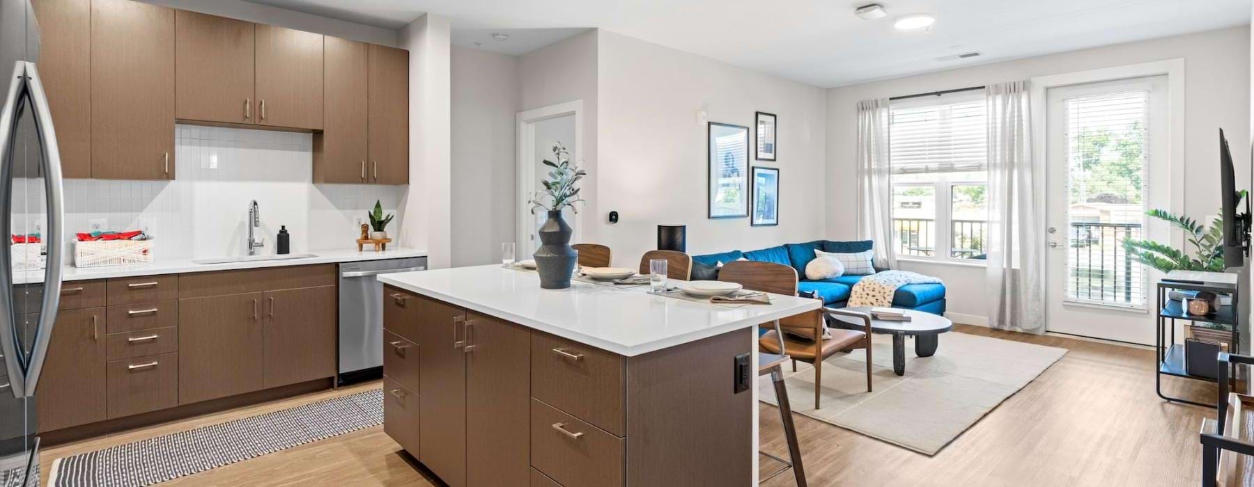 a large kitchen with a couch and a dining table